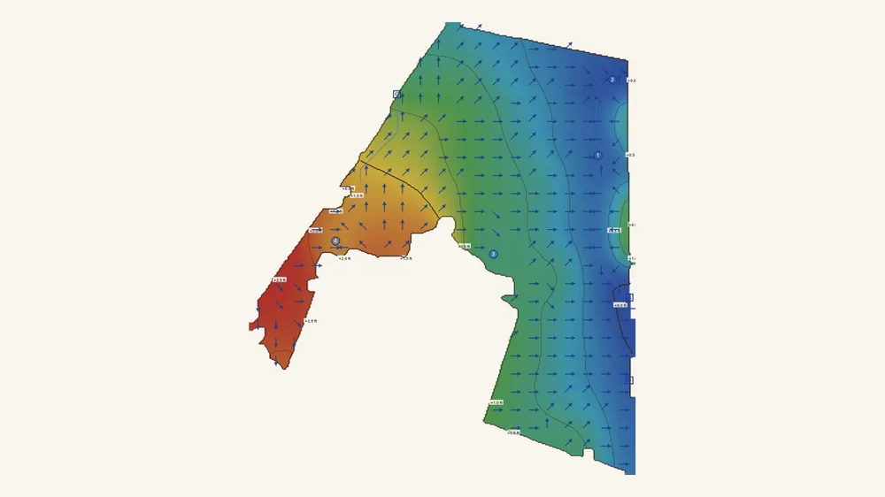 A backyard read from its scan: the ground by height, red high and blue low, arrows showing where the water runs.