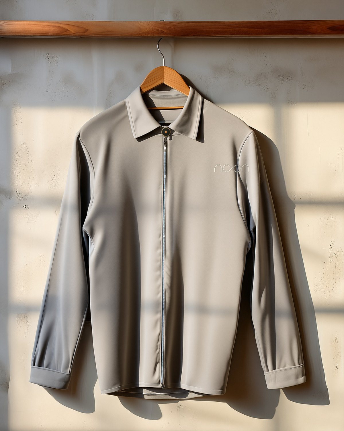 The same riding shirt all in warm grey, no trim