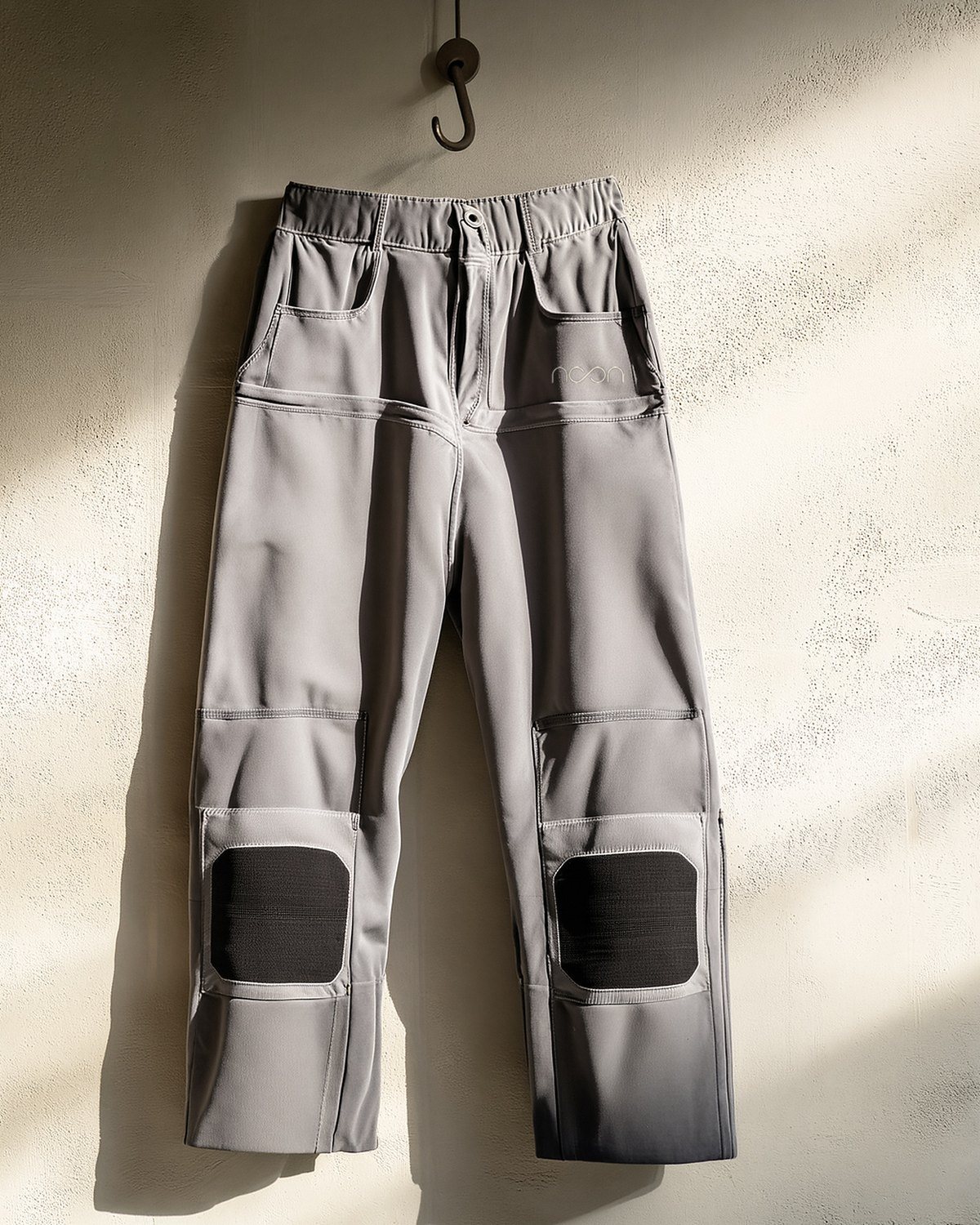 Grey work trousers with reinforced patches at the knee