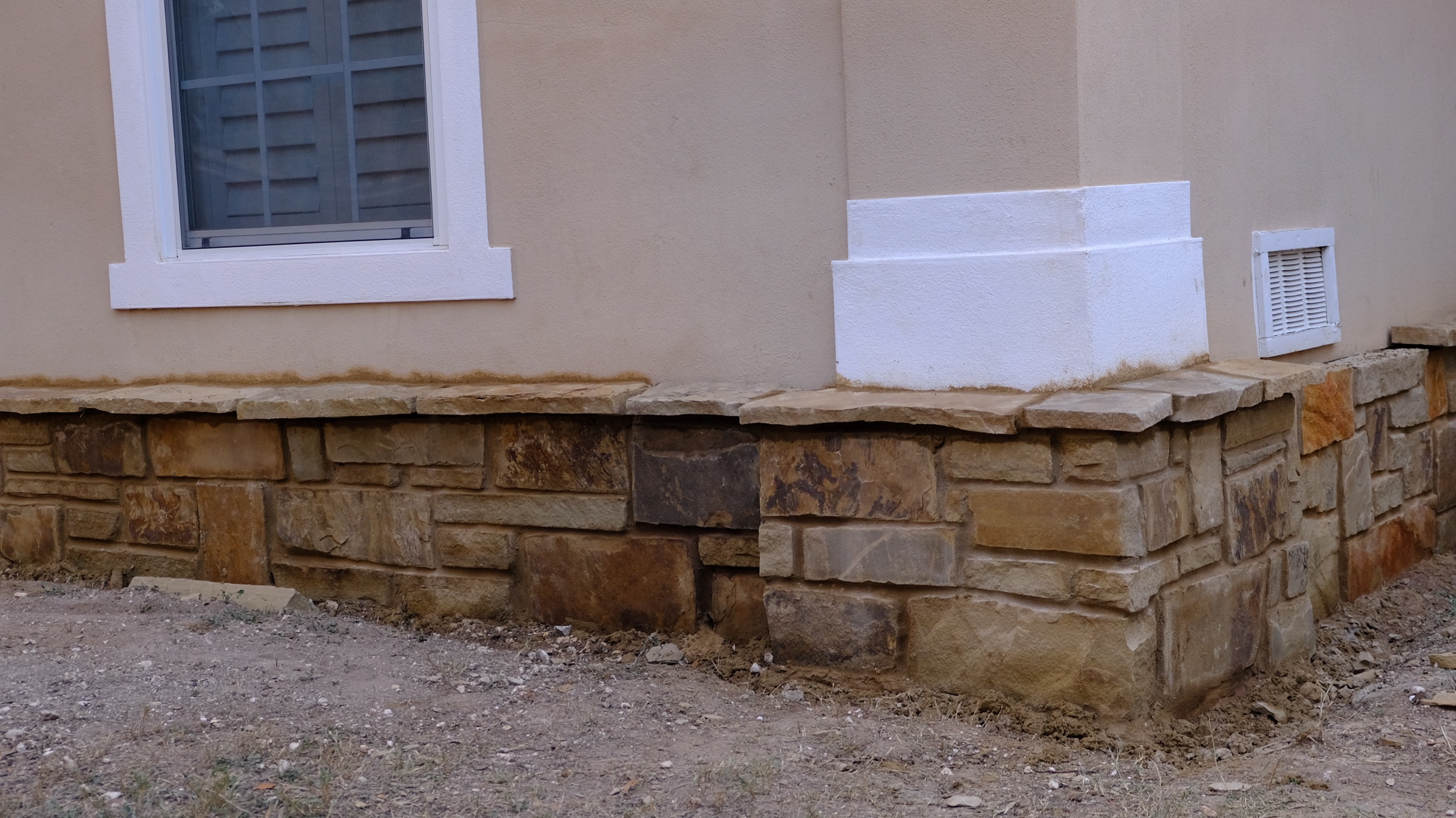 Hand-laid stone wall.