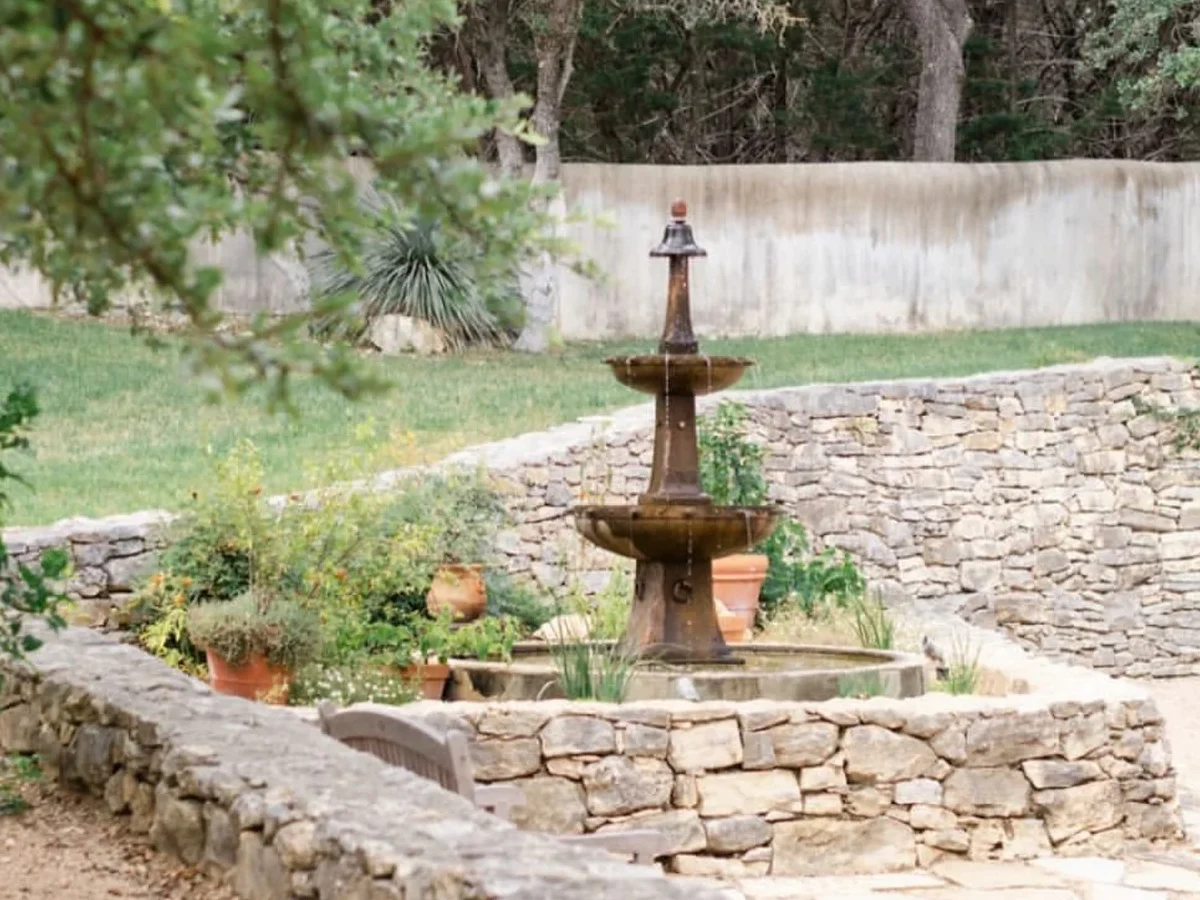 Huerta de Atrio — the mission courtyard garden, tiered fountain and stone terraces, planted with natives and heritage food.