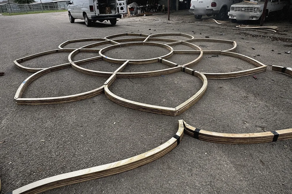 The eight petal forms laid out dry on the yard to check the figure before the haul.