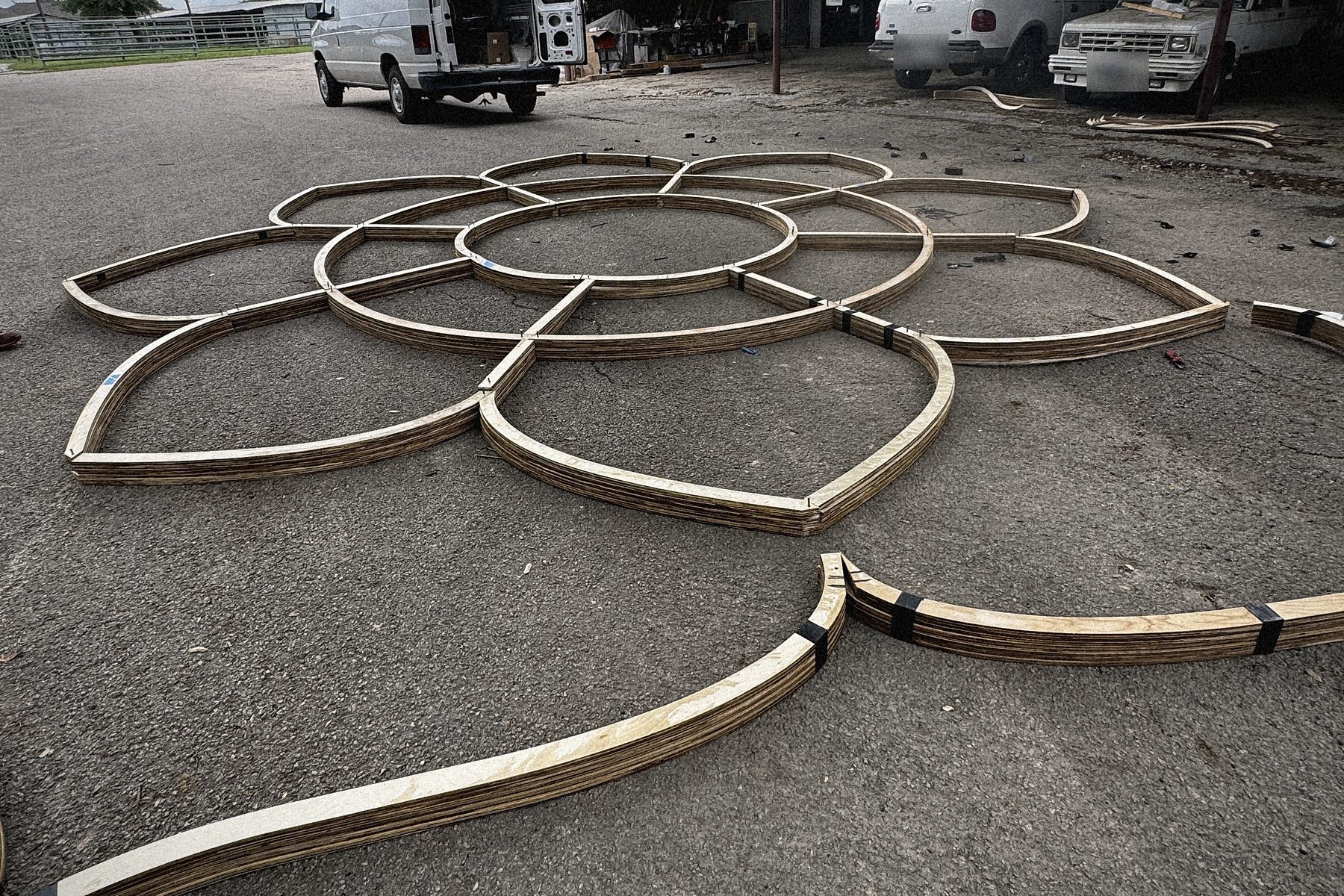 The eight petal forms laid out dry on the yard to check the figure before the haul.
