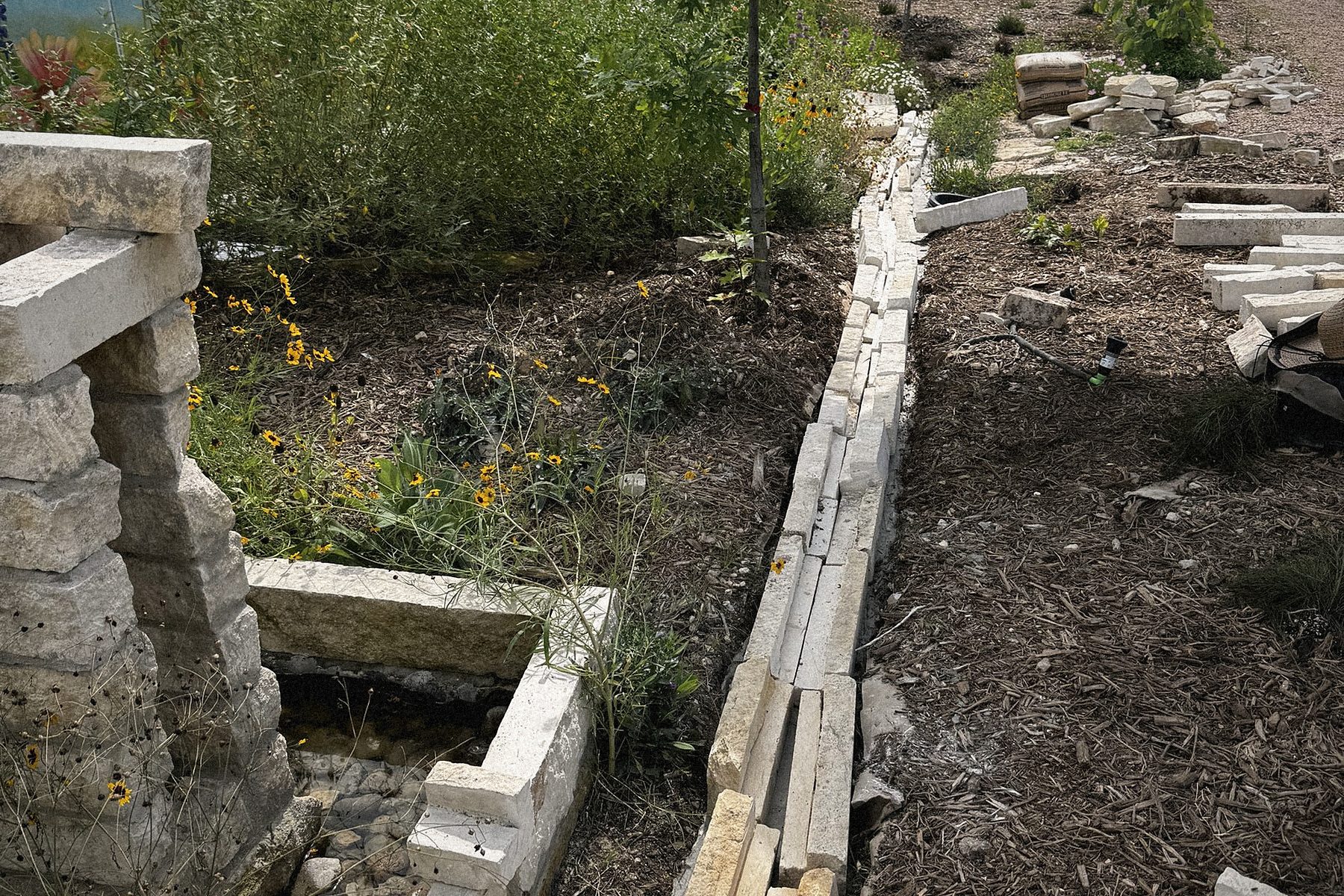 Laying the limestone rill by hand.